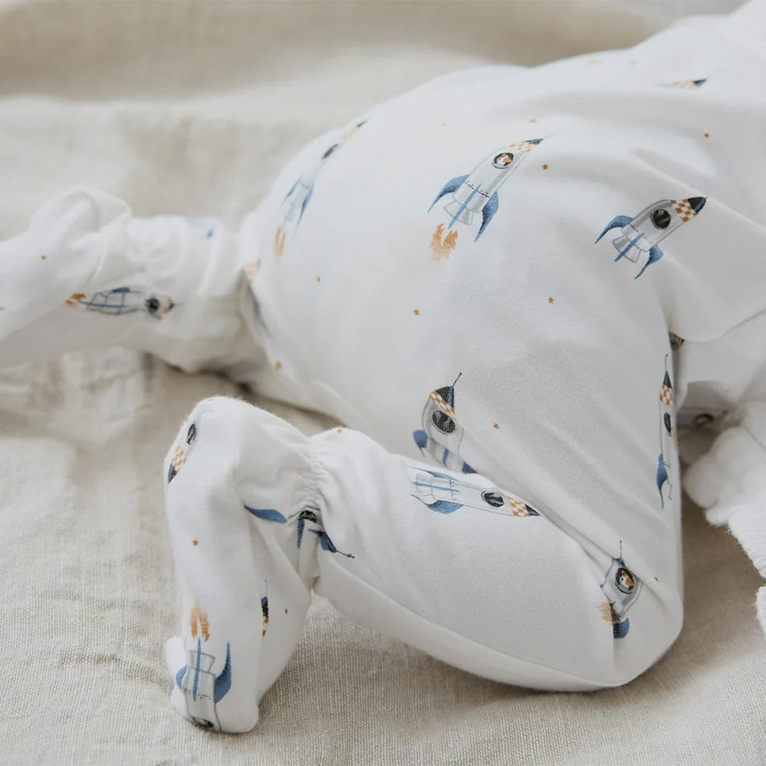 Rocket Print on Off White Footed Sleeper | Petit Lem